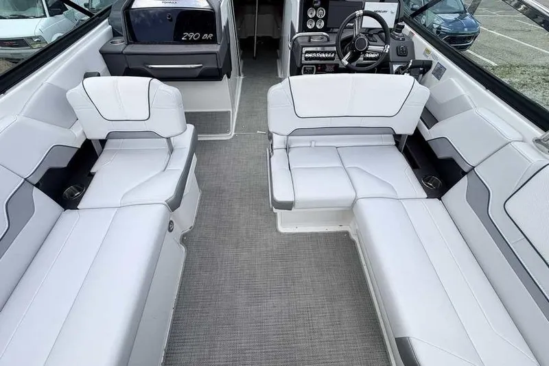 Slide: The Image of 2022 Formula 290 Bowrider interior with white seating and modern dashboard. - 5