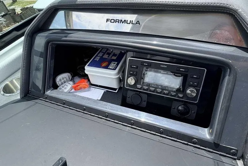 Slide: The Image of Dashboard of 2022 Formula 290 Bowrider with stereo system and storage compartment. - 7