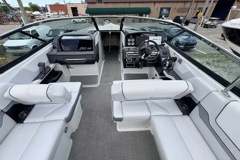 Slide: The Image of 2022 Formula 290 Bowrider interior with modern seating and dashboard controls. - 9