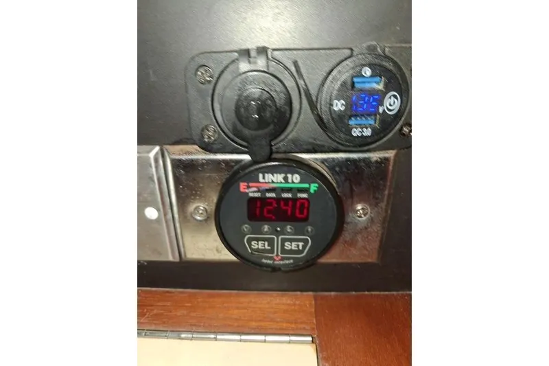 Slide: The Image of Control panel on a 1991 Freedom Yachts 38, displaying digital readings. - 12