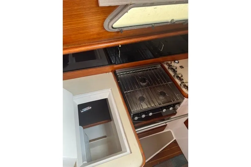 Slide: The Image of 1991 Freedom Yachts 38 galley with stove and storage compartments. - 15