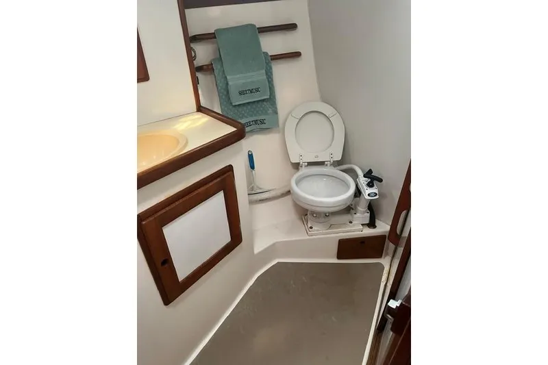 Slide: The Image of Bathroom interior of 1991 Freedom Yachts 38, featuring toilet and sink. - 25
