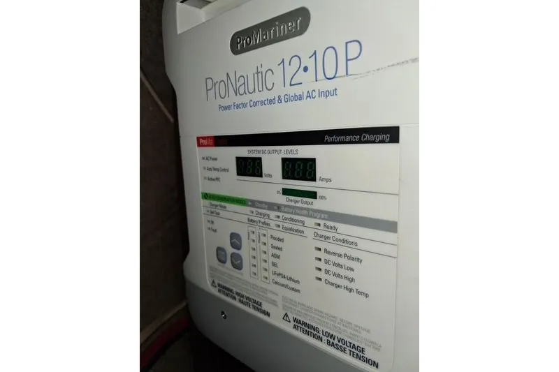 Slide: The Image of ProNautic 12:10P charger on 1991 Freedom Yachts 38, displaying system output levels. - 30
