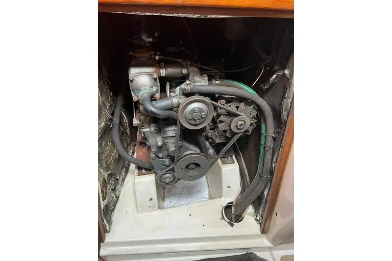 Slide: The Image of Engine compartment of a 1991 Freedom Yachts 38 sailboat, showing mechanical components. - 32