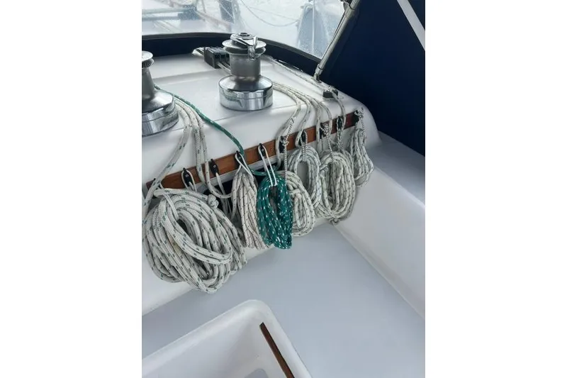 Slide: The Image of Coiled ropes and winches on 1991 Freedom Yachts 38 sailboat deck. - 6
