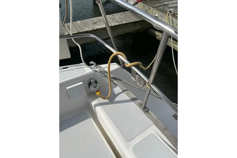 Slide: The Image of 1991 Freedom Yachts 38 deck with railing and power connection. - 7