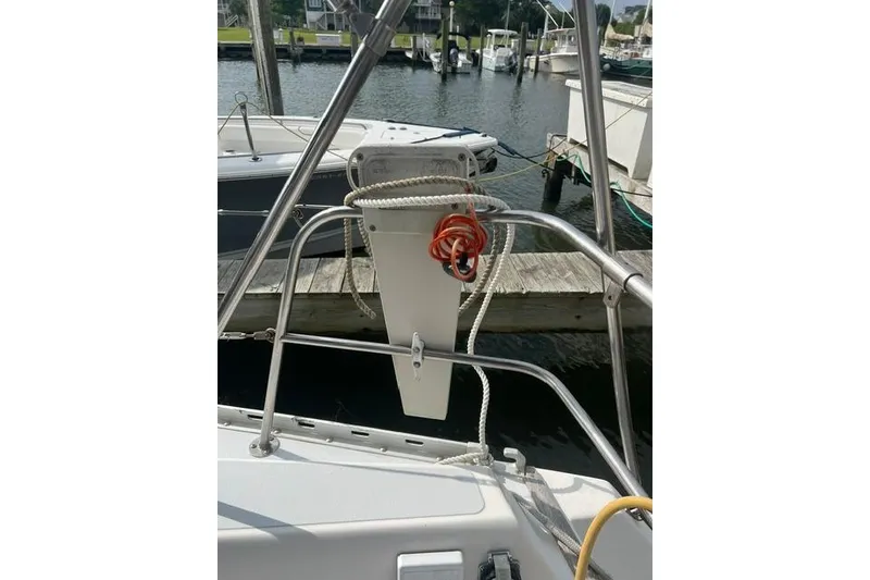 Slide: The Image of Sailboat stern view with ropes, docked at marina, Freedom Yachts 38, 1991 model. - 8