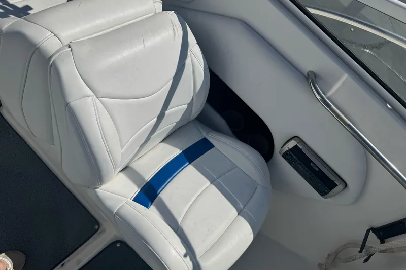 Slide: The Image of White leather seat in 2002 Campion Explorer 602 Sport Cabin boat interior. - 14