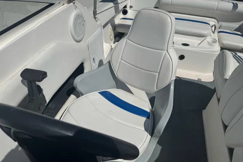Slide: The Image of Interior of a 2002 Campion Explorer 602 Sport Cabin boat with white seating. - 15