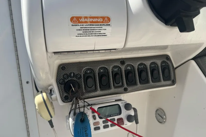 Slide: The Image of Control panel of a 2002 Campion Explorer 602 Sport Cabin boat with warning label. - 17