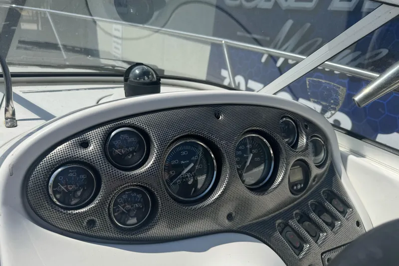 Slide: The Image of Dashboard of a 2002 Campion Explorer 602 Sport Cabin boat with gauges and controls. - 18