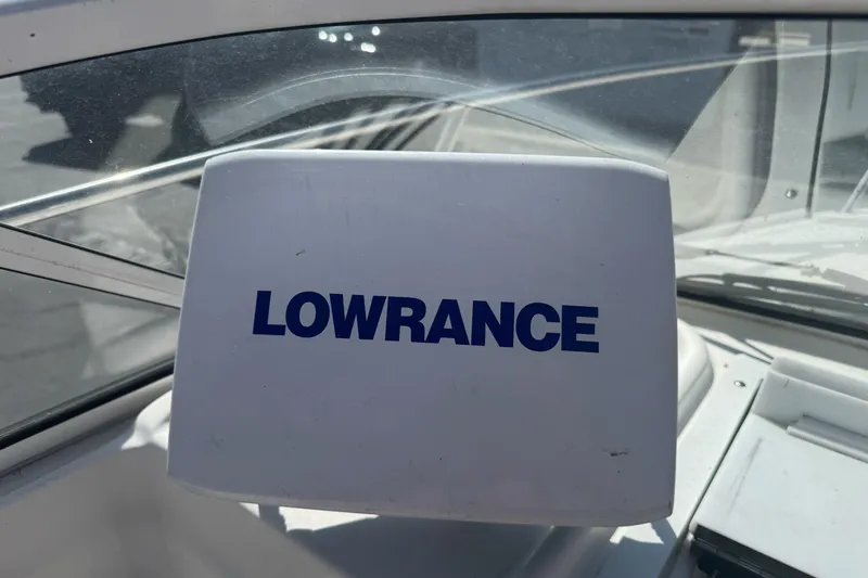 Slide: The Image of Lowrance device on 2002 Campion Explorer 602 Sport Cabin boat dashboard. - 19