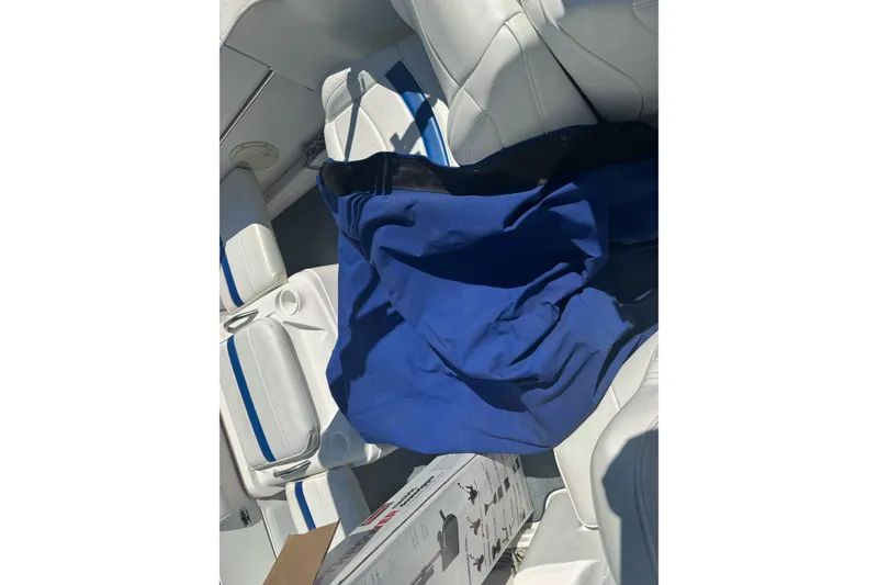 Slide: The Image of 2002 Campion Explorer 602 Sport Cabin interior with blue cover on white seats. - 21