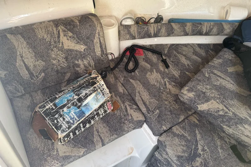 Slide: The Image of Interior of 2002 Campion Explorer 602 Sport Cabin with patterned seating and equipment. - 25