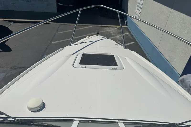 Slide: The Image of 2002 Campion Explorer 602 Sport Cabin boat deck with railing and hatch. - 28