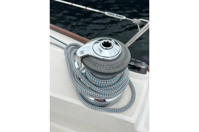 Slide: The Image of Winch with rope on 1998 Sabre 362 sailboat deck, near water. - 11