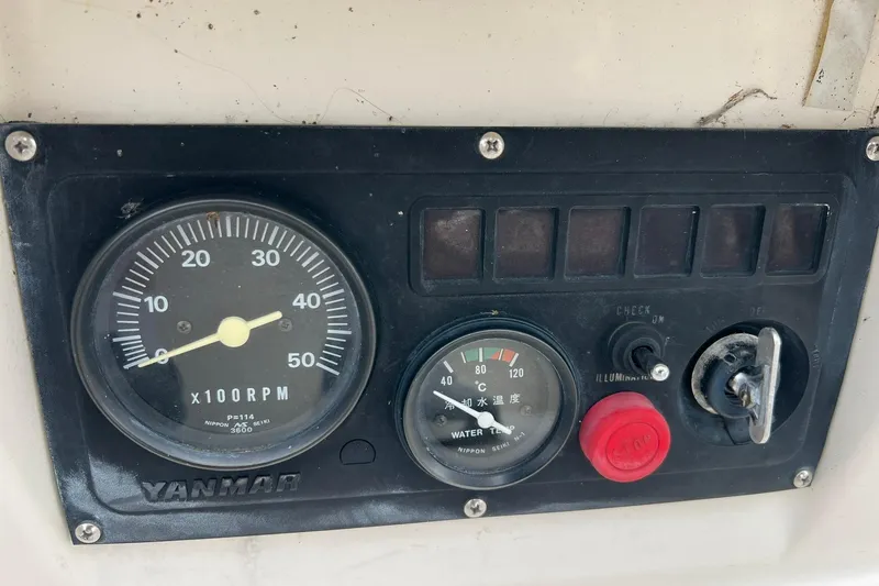 Slide: The Image of Control panel of a 1998 Sabre 362 with Yanmar RPM and temperature gauges. - 13