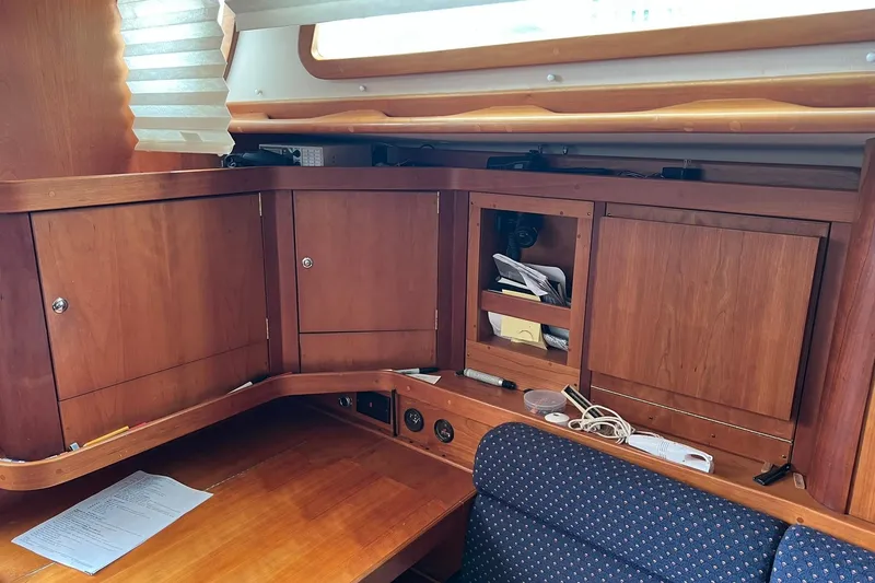 Slide: The Image of Interior of a 1998 Sabre 362 sailboat with wooden cabinetry and seating area. - 23