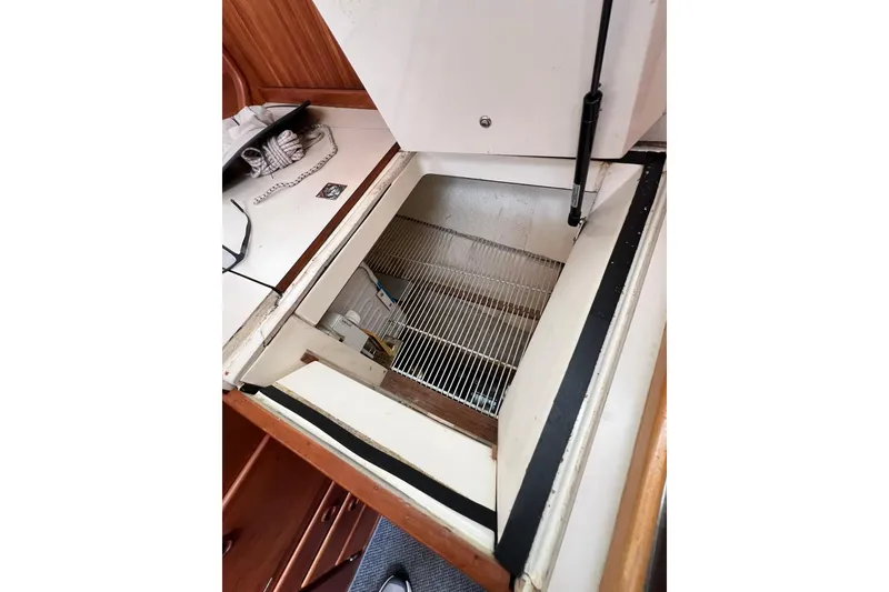 Slide: The Image of Open storage compartment in 1998 Sabre 362 yacht interior. - 27