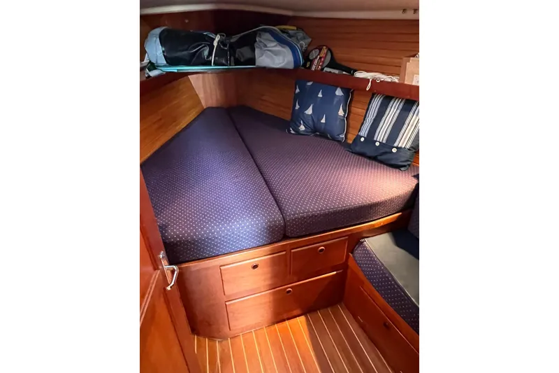 Slide: The Image of Cozy cabin interior of 1998 Sabre 362 sailboat with nautical-themed cushions. - 31