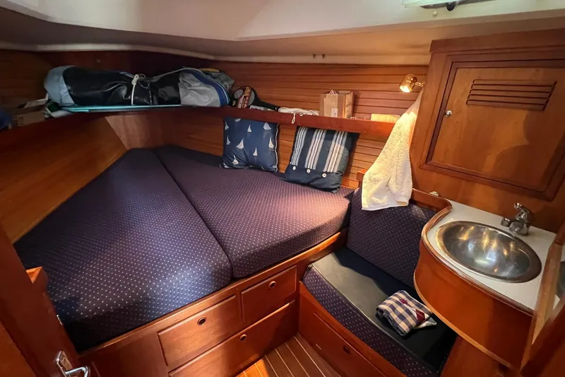 Slide: The Image of Cozy cabin interior of 1998 Sabre 362 sailboat with bed, sink, and storage. - 32