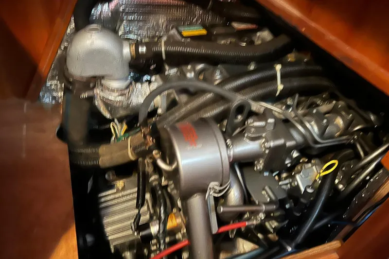 Slide: The Image of Engine compartment of a 1998 Sabre 362 sailboat, showcasing mechanical components and wiring. - 37