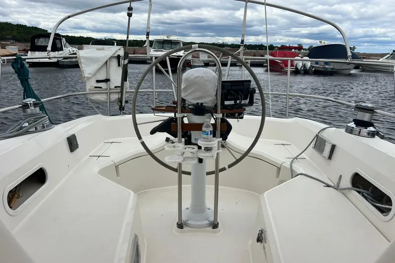 Slide: The Image of Cockpit view of a 1998 Sabre 362 sailboat docked at a marina. - 4
