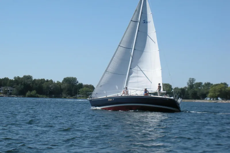 Slide: The Image of Sailing on a 1999 Sabre 362 yacht with white sails on a sunny day. - 1
