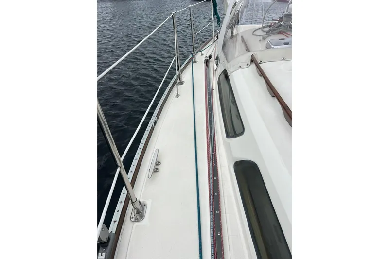 Slide: The Image of Deck view of a 1998 Sabre 362 sailboat on the water. - 5