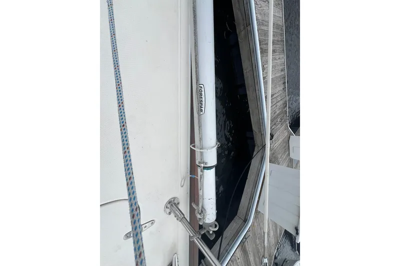 Slide: The Image of Deck view of a 1998 Sabre 362 sailboat, featuring rigging and dockside details. - 7