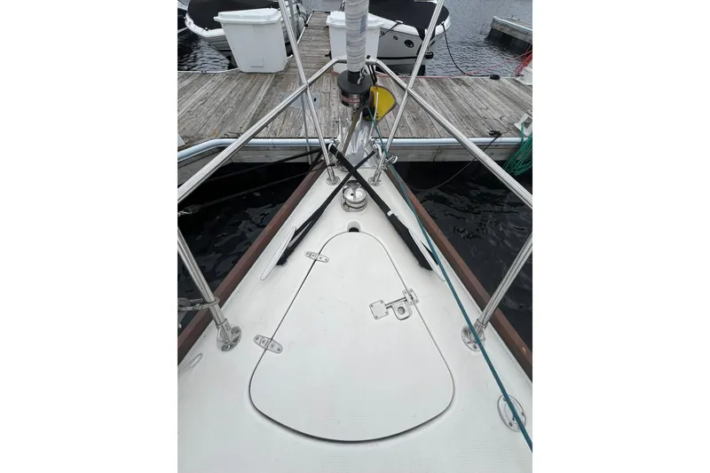 Slide: The Image of Bow of a 1998 Sabre 362 sailboat docked at a marina. - 8