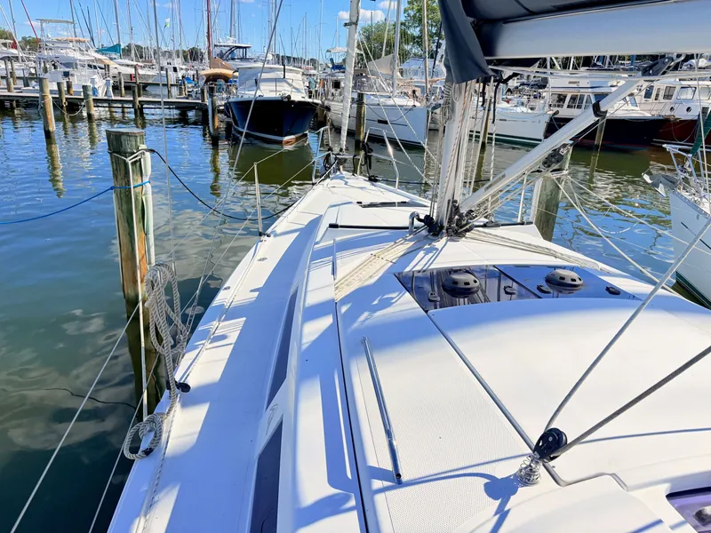 Slide: The Image of A modern sailboat docked in a busy marina. - 16