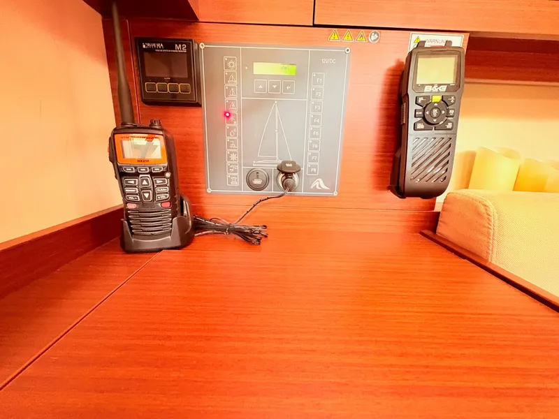 Slide: The Image of Interior view of a Hanse 348 boat with communication devices and control panel. - 37