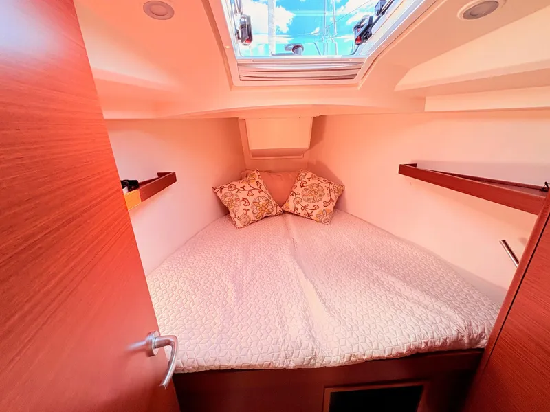Slide: The Image of Interior of a Hanse 348 yacht with a cozy bed and skylights. - 41