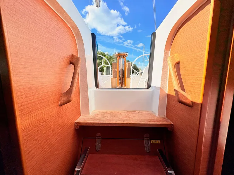 Slide: The Image of View from inside a Hanse 348 yacht looking out to the cockpit and blue sky. - 45