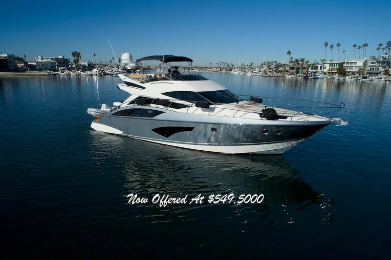 The Image of Luxurious 2013 Marquis 500 Sport Bridge yacht on serene water, priced at $549,500. - 0