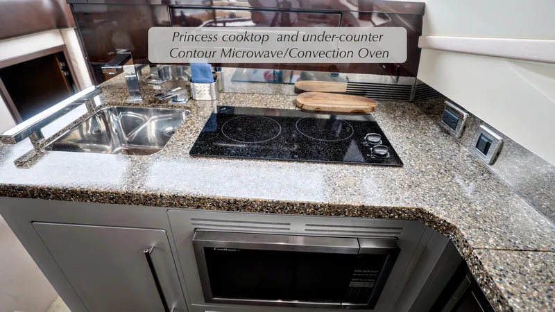 Slide: The Image of Luxurious kitchen in 2013 Marquis 500 Sport Bridge with cooktop and microwave. - 26