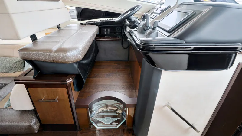 Slide: The Image of Interior helm of 2013 Marquis 500 Sport Bridge yacht with modern controls and seating. - 29