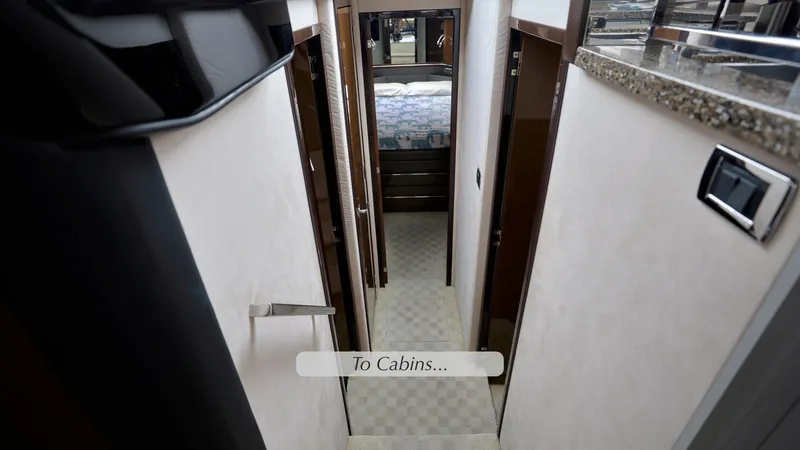 Slide: The Image of Interior hallway of 2013 Marquis 500 Sport Bridge yacht leading to cabins. - 31