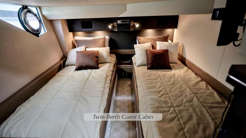 Slide: The Image of Twin berth guest cabin in 2013 Marquis 500 Sport Bridge yacht, featuring cozy bedding. - 35