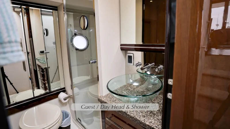 Slide: The Image of Luxurious bathroom in 2013 Marquis 500 Sport Bridge yacht with glass sink and shower. - 36