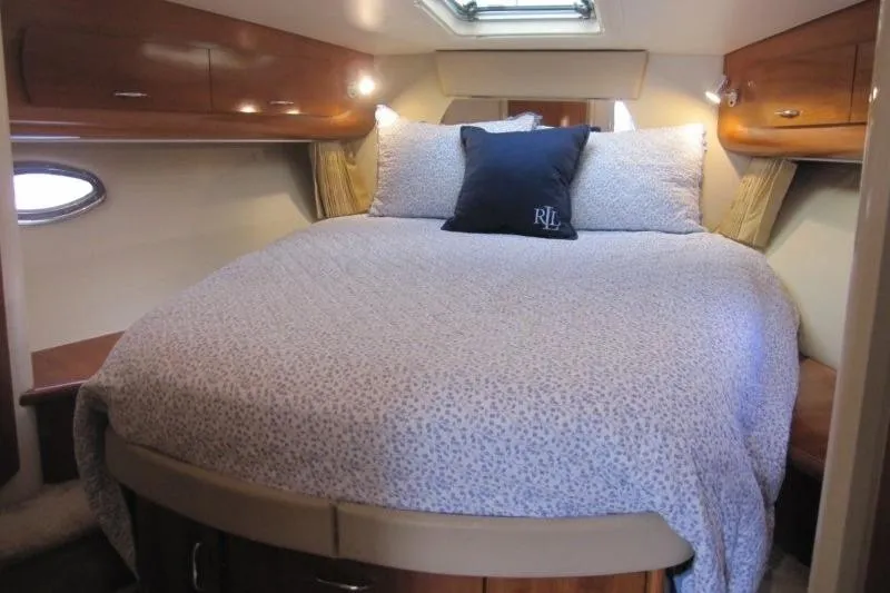 Slide: The Image of Luxurious bedroom interior of 2006 Carver 36 Mariner yacht with cozy bedding. - 17