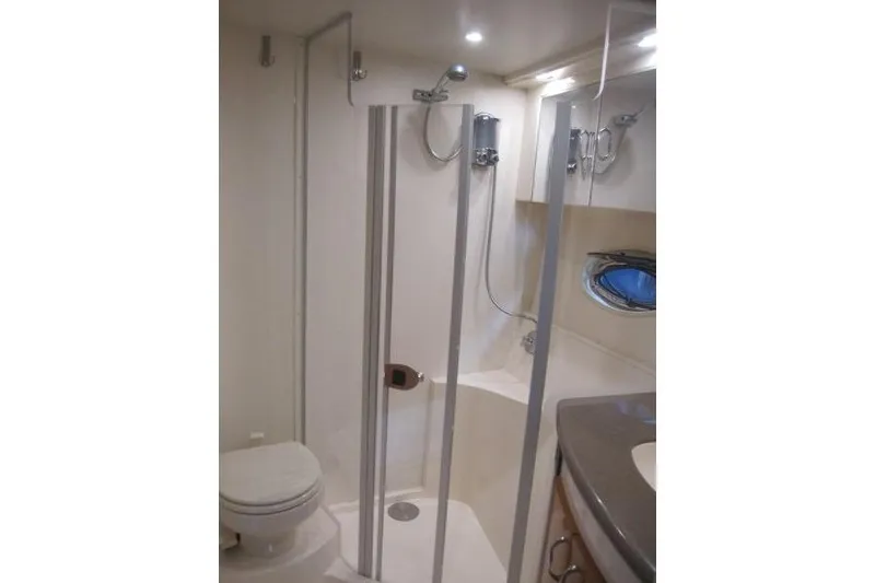 Slide: The Image of Bathroom interior of 2006 Carver 36 Mariner yacht, featuring shower and toilet. - 19