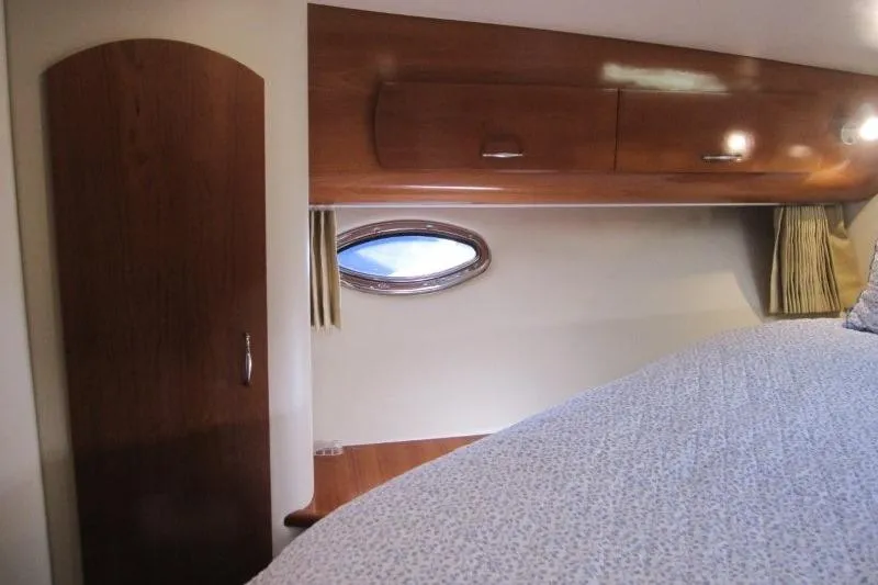 Slide: The Image of Interior cabin of 2006 Carver 36 Mariner with wood paneling and porthole window. - 20