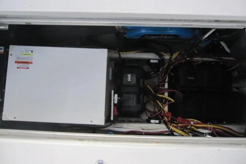Slide: The Image of Engine compartment of a 2006 Carver 36 Mariner with visible wiring and components. - 24