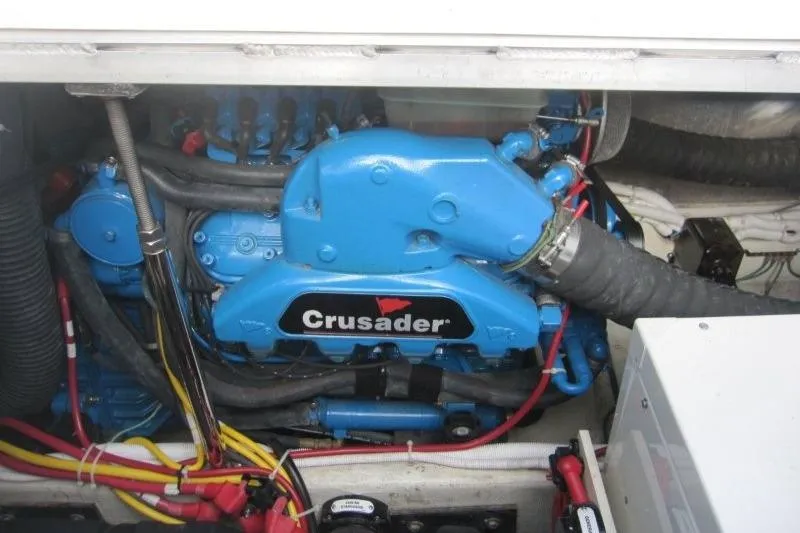 Slide: The Image of Engine compartment of a 2006 Carver 36 Mariner with a blue Crusader engine. - 26