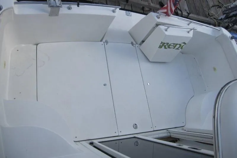 Slide: The Image of 2006 Carver 36 Mariner boat deck with storage compartments and American flag. - 28