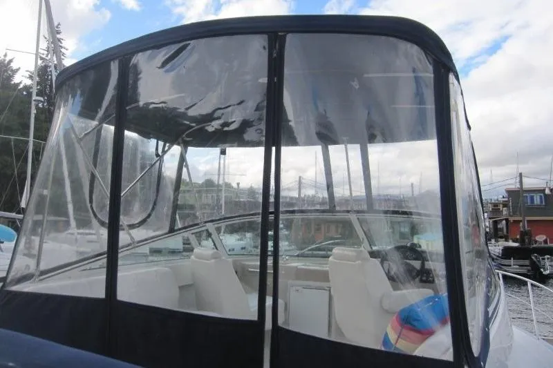 Slide: The Image of 2006 Carver 36 Mariner boat with enclosed cockpit at marina. - 30