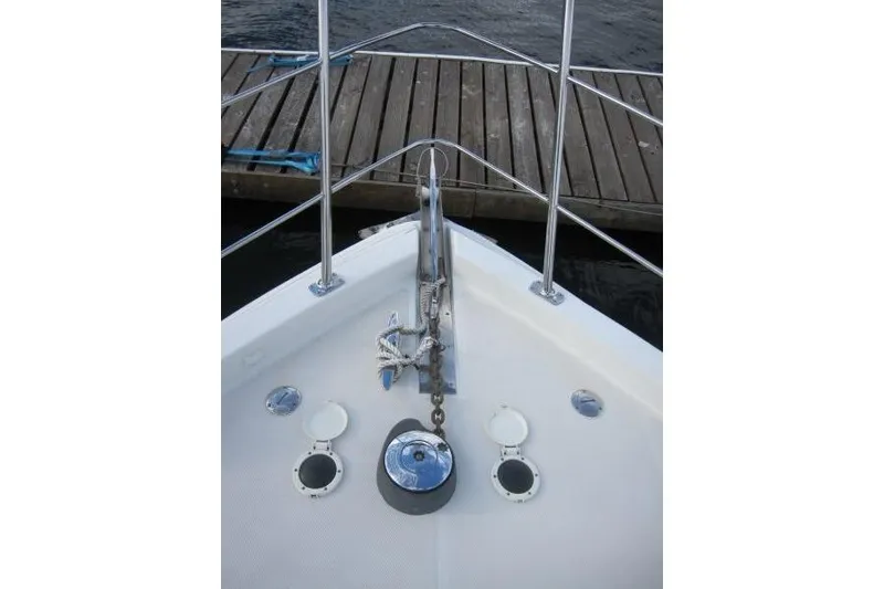 Slide: The Image of Bow view of 2006 Carver 36 Mariner yacht at dock. - 32