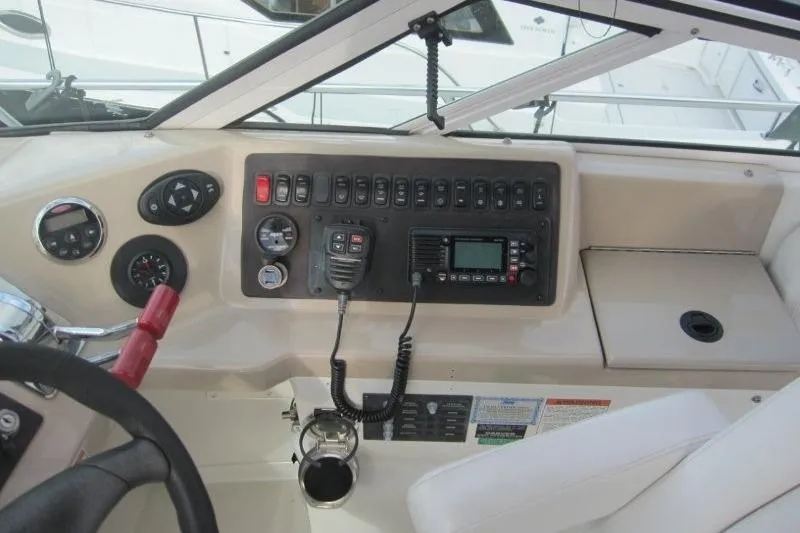 Slide: The Image of Control panel of a 2006 Carver 36 Mariner boat with navigation instruments. - 40